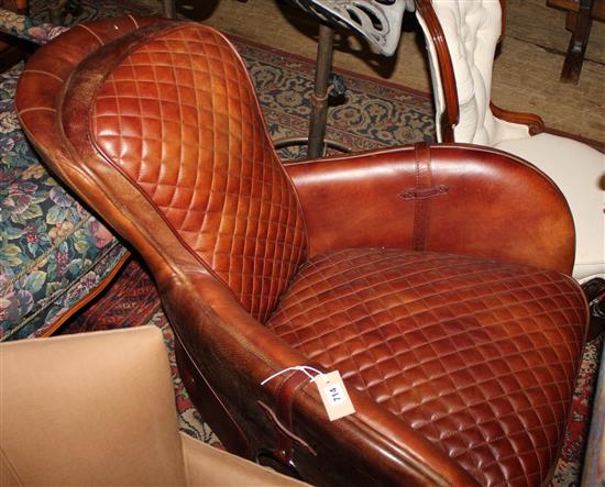 A leather saddle chair, desgined by Timothy Oulton